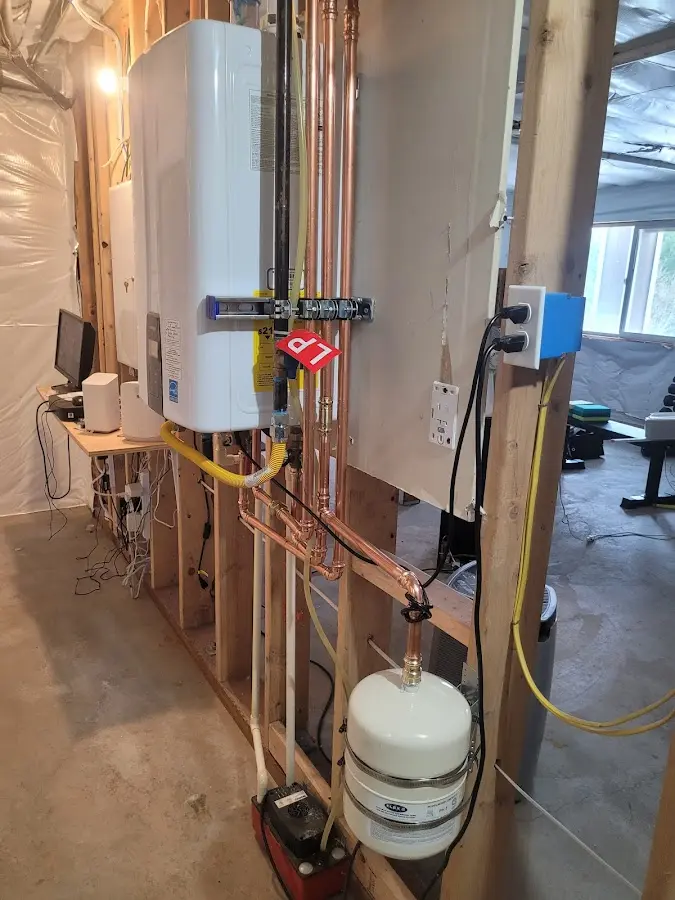 Licensed plumber repairing a kitchen sink in Arcade